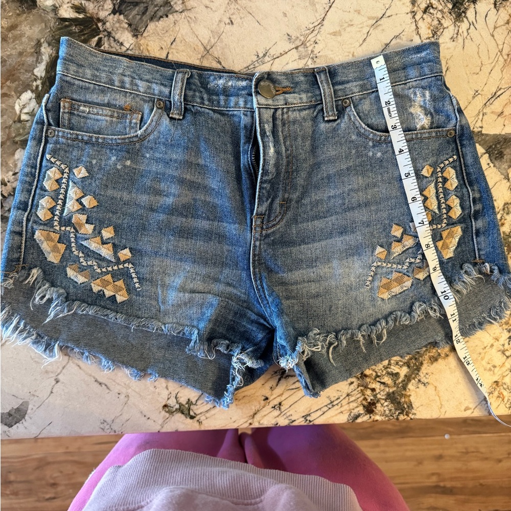Free People denim shorts.